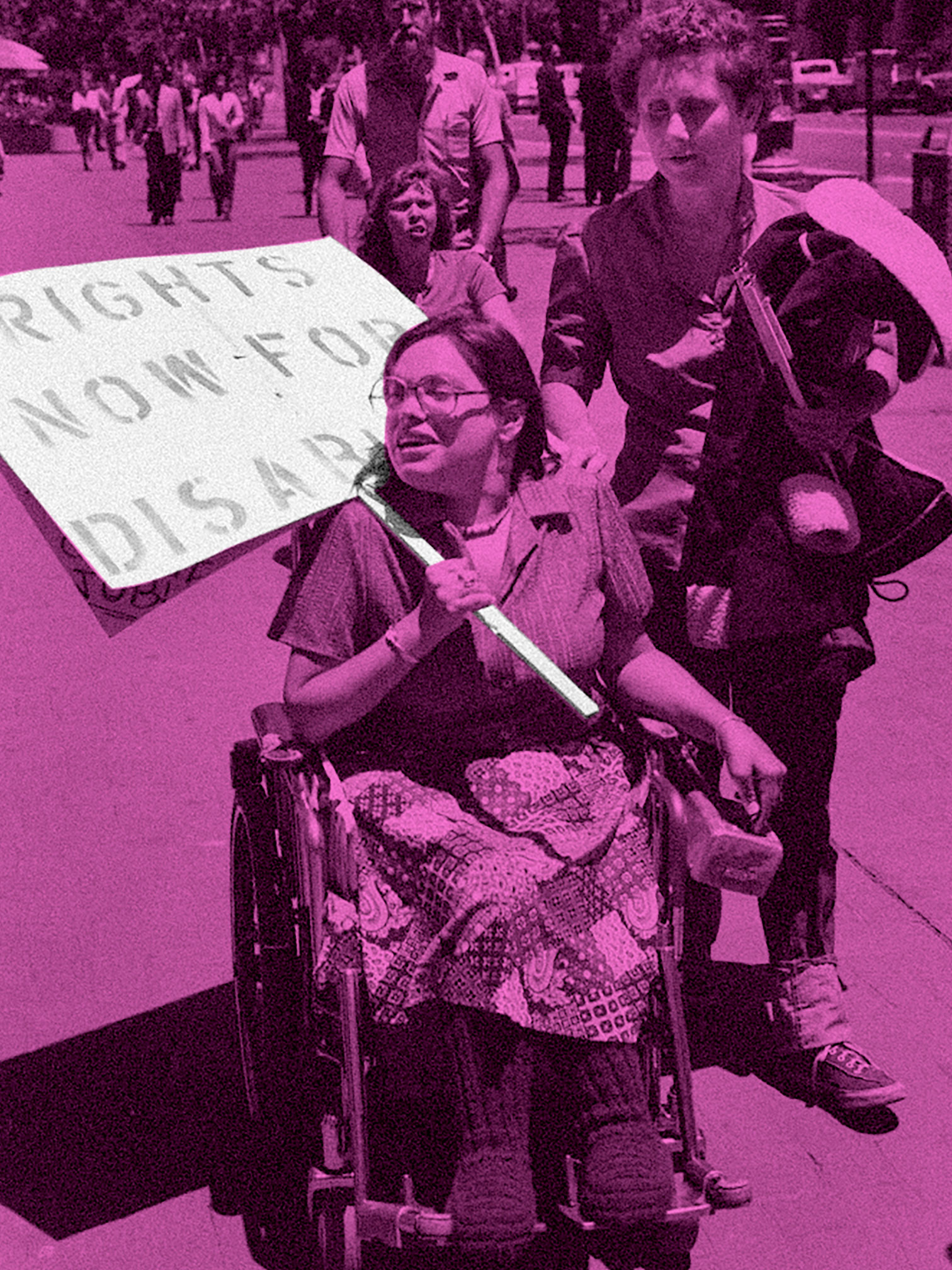 Judy Heumann attends a disability rights protest. She uses a wheelchair and holds a sign that reads “RIGHTS NOW FOR DISABLED.” The image is filtered in neon pink, while the sign remains filtered black and white.
