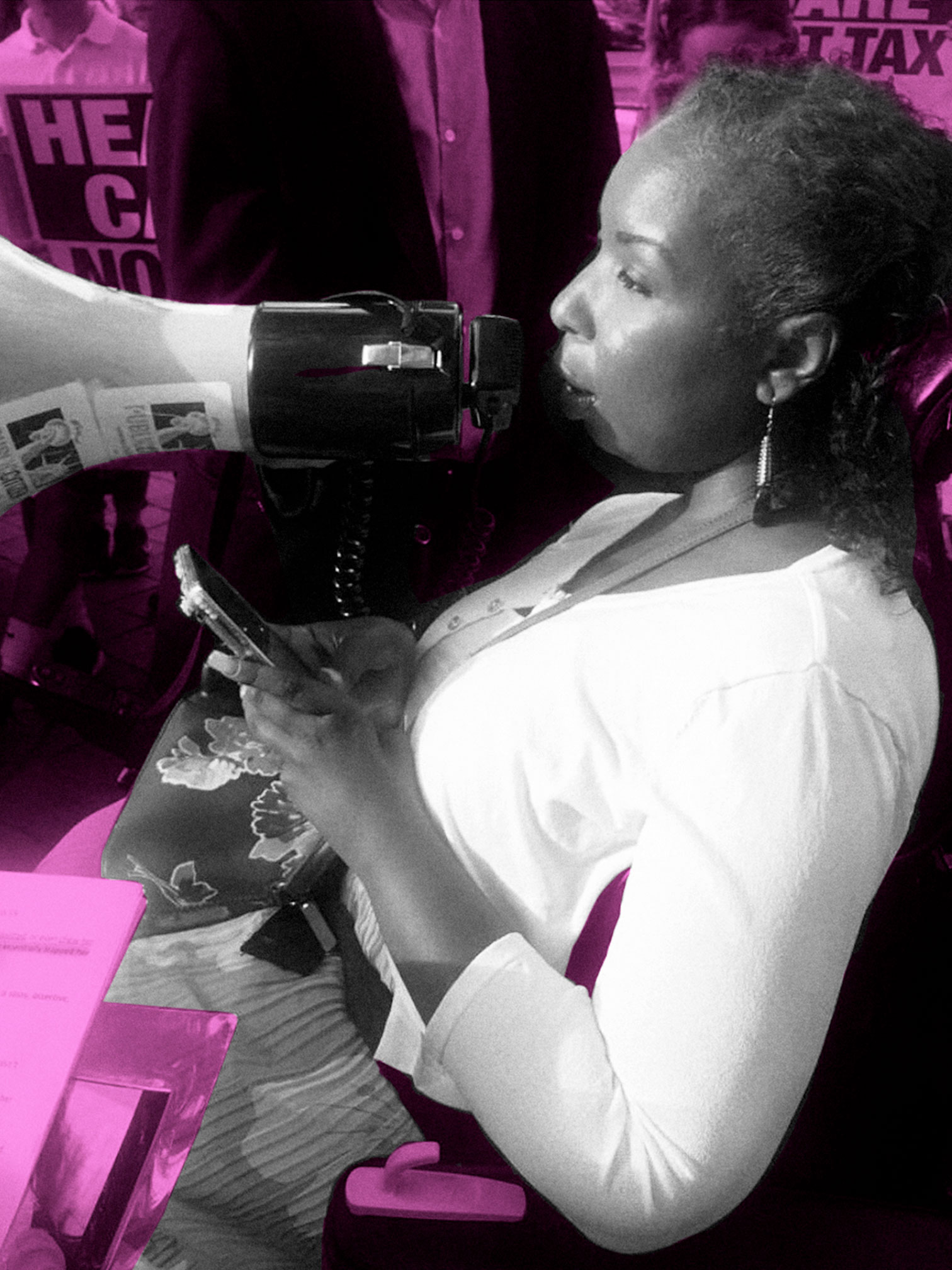 Andraéa LaVant uses a wheelchair and faces to the left, holding a phone and speaking to a crowd at a protest out of a microphone. The image is filtered in neon pink, while Andraéa is filtered in black and white.